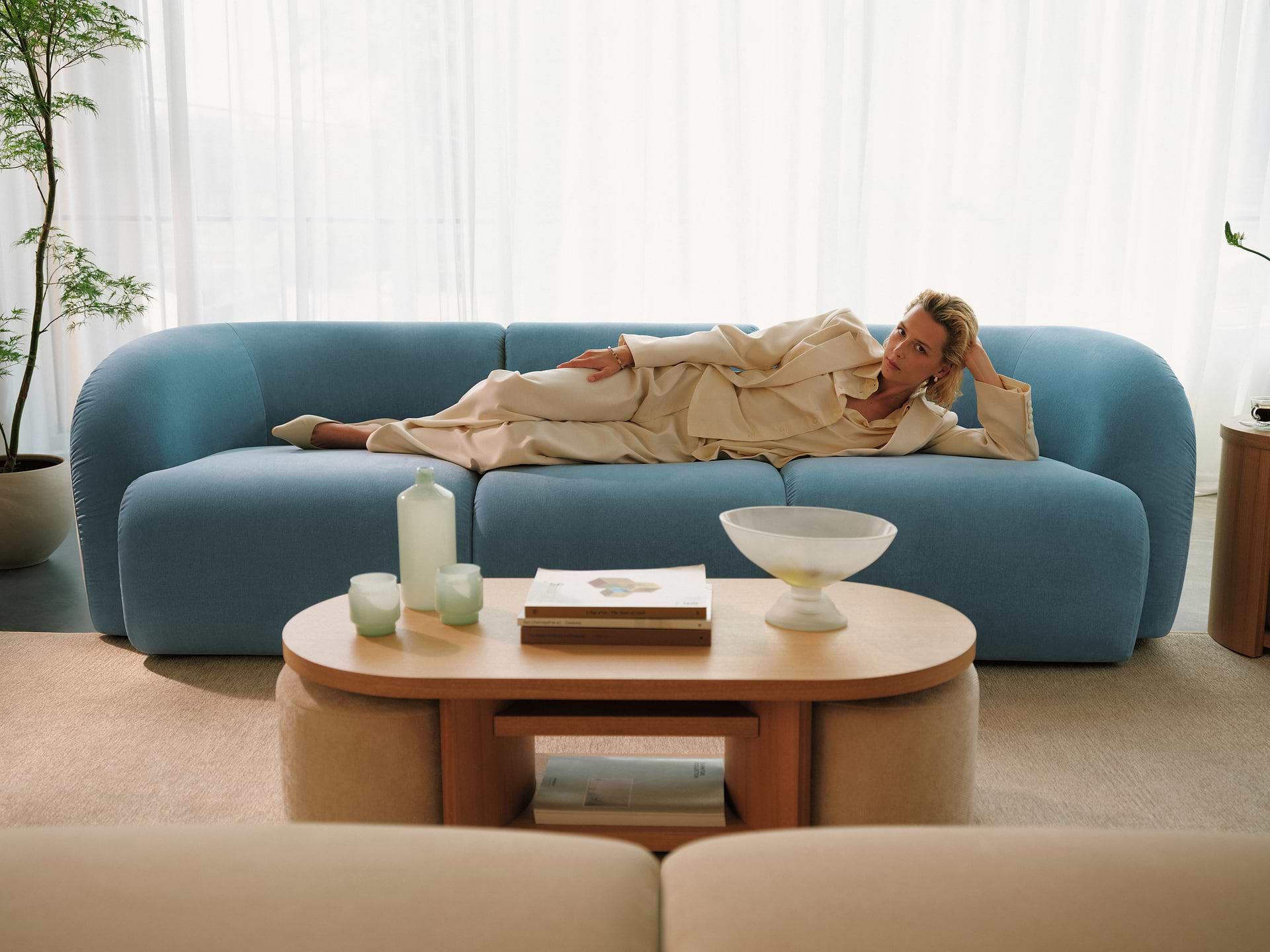 Lounging on aqua sofa