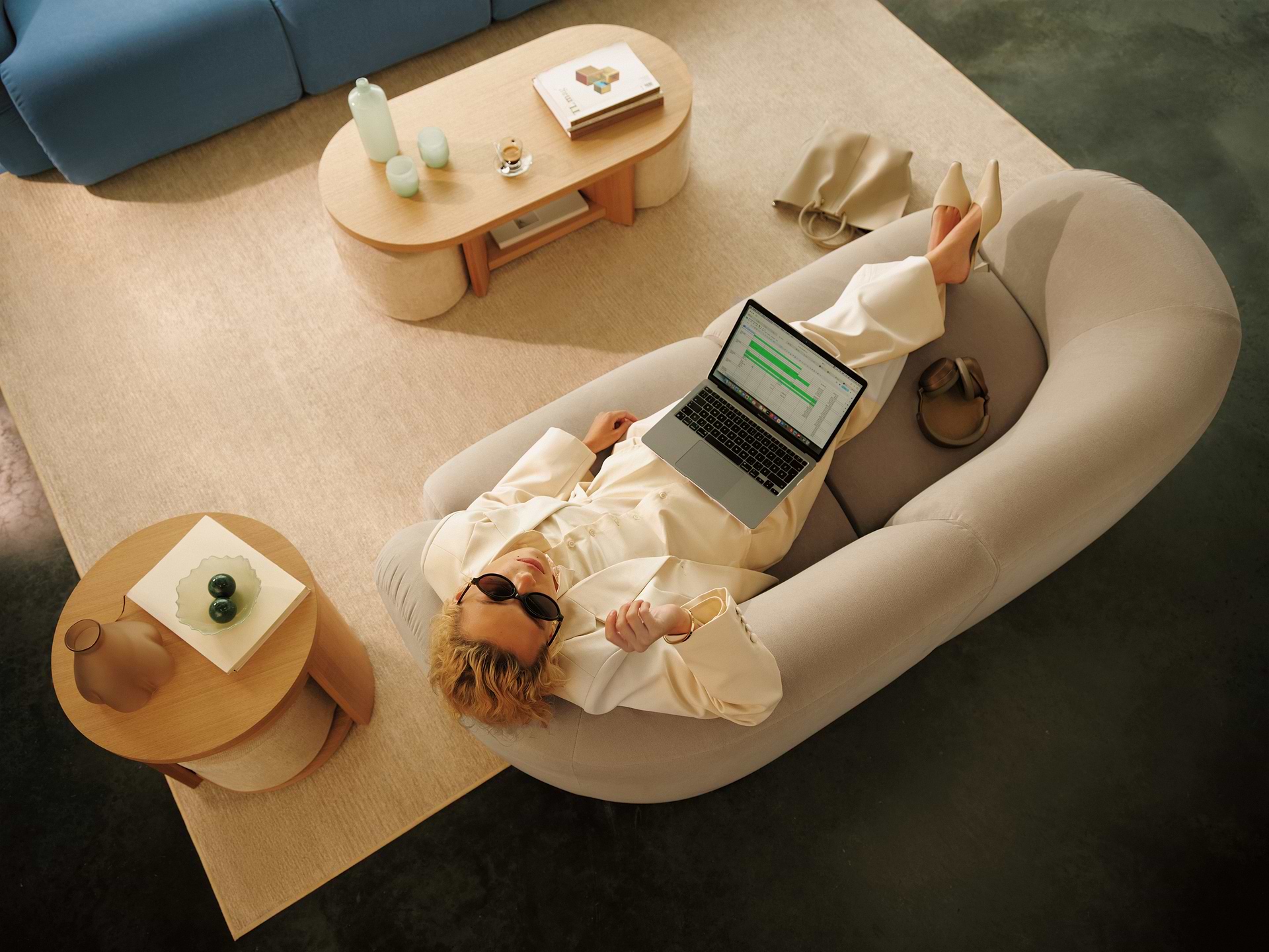 Woman working on crumble color sofa