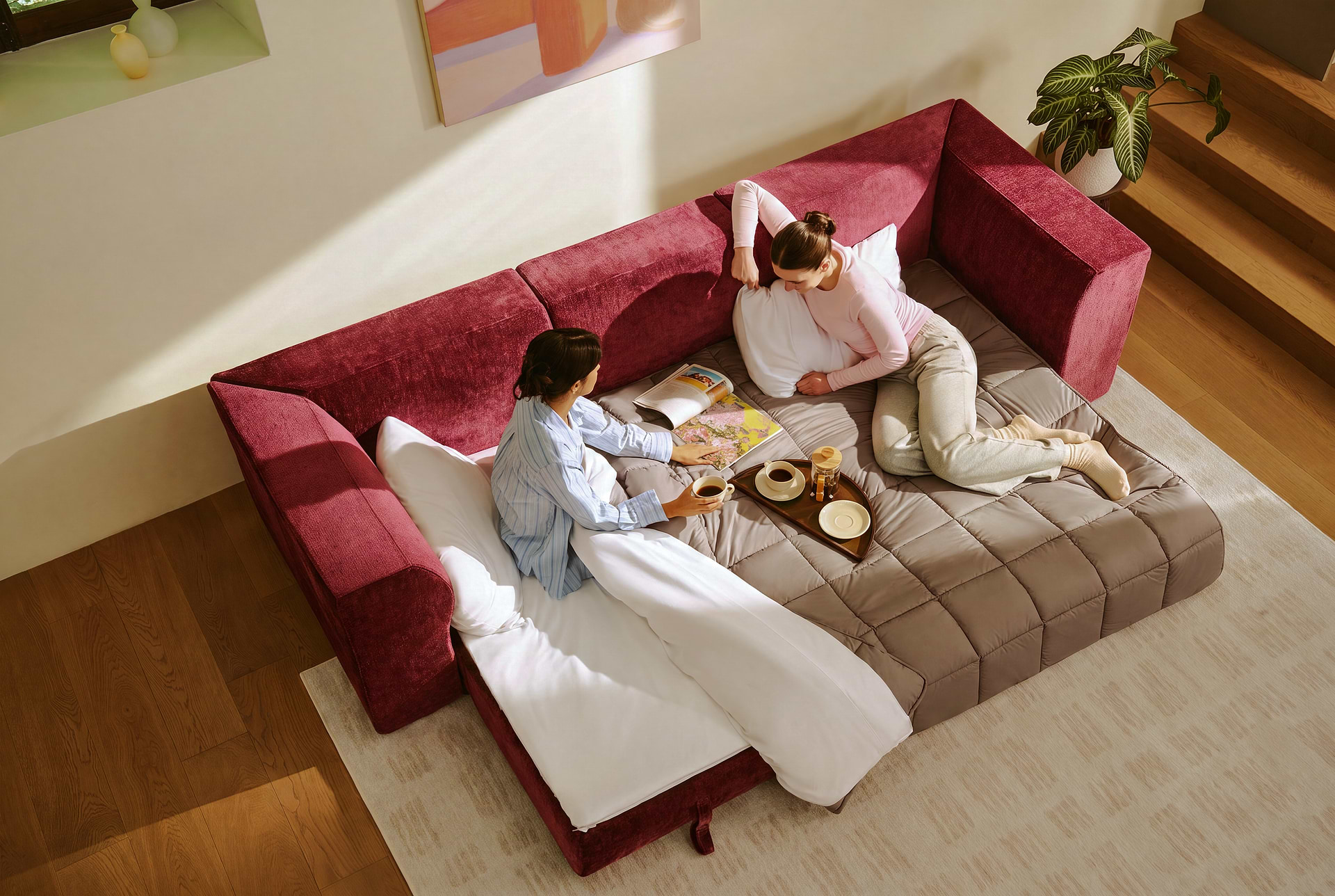 Friends on red sofa bed