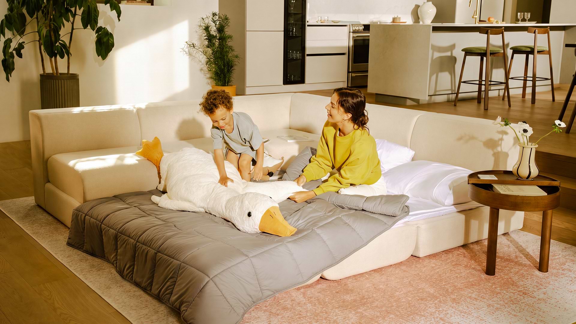 Mother and son on white sofa bed