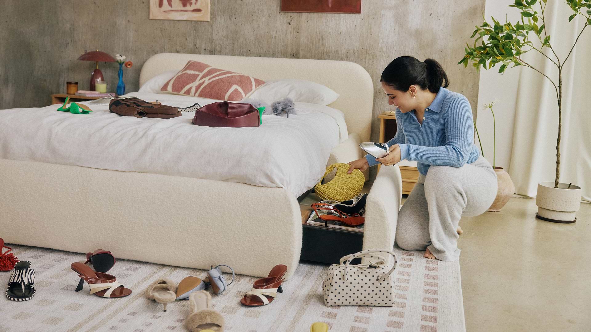 Woman organizing bed storage