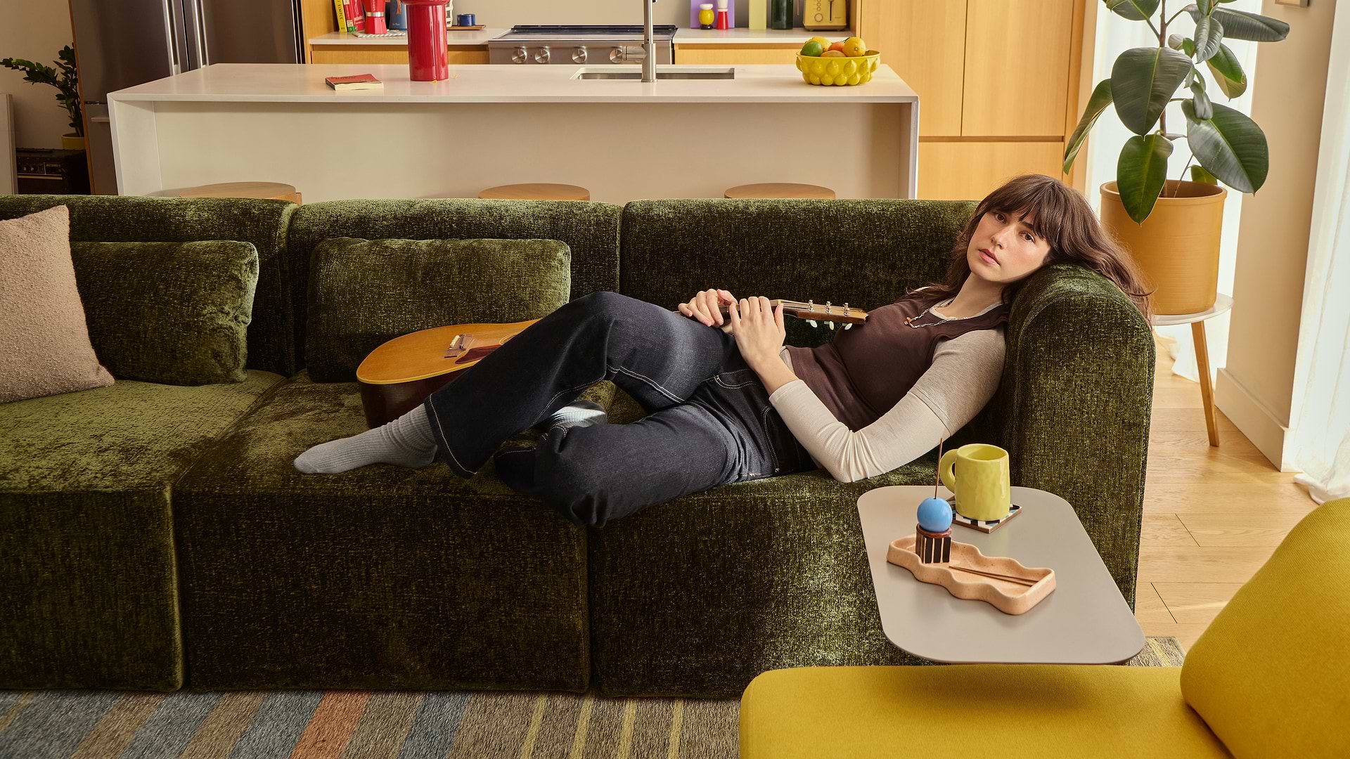 Woman on a green sofa