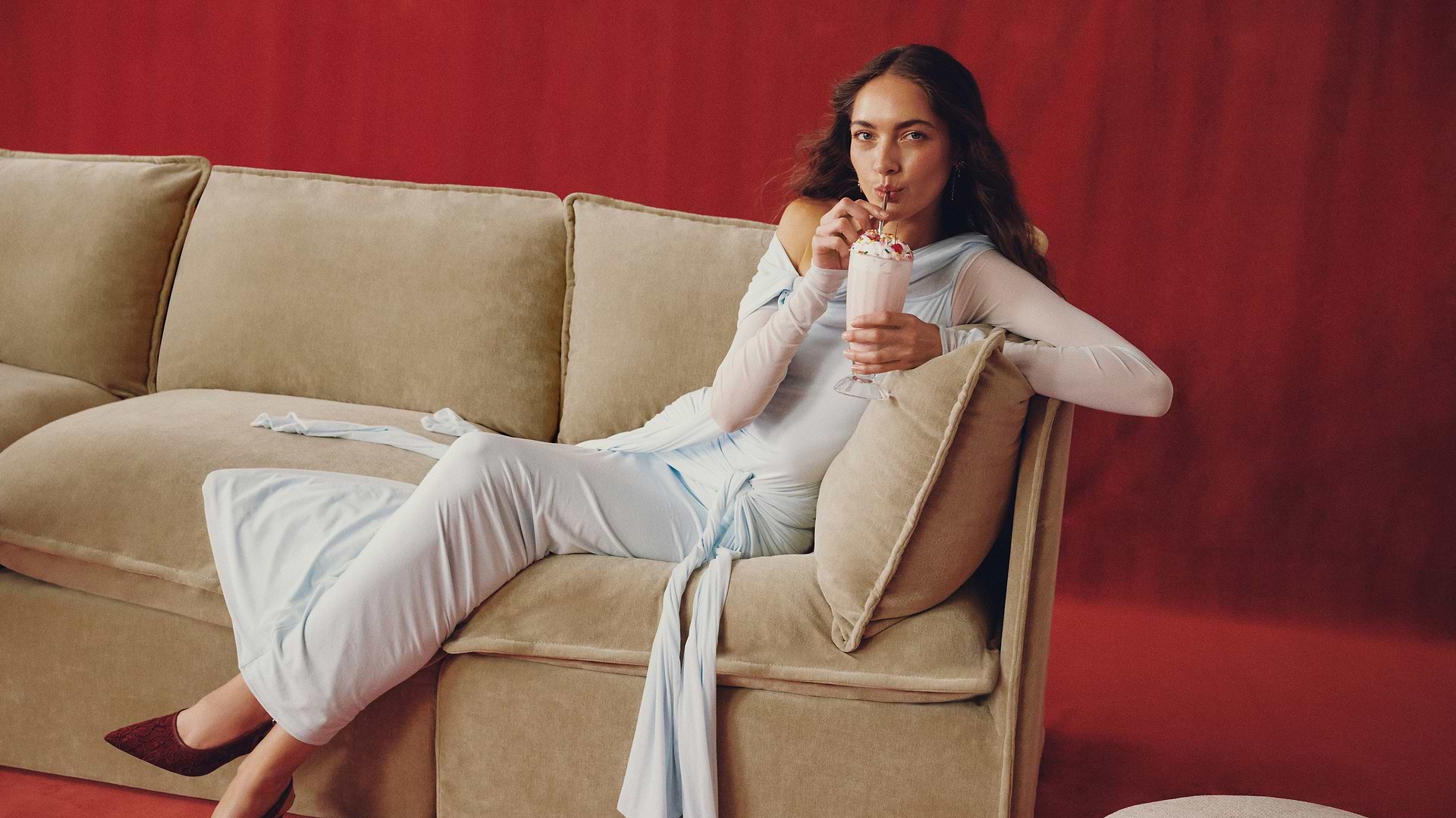 Woman on beige sofa