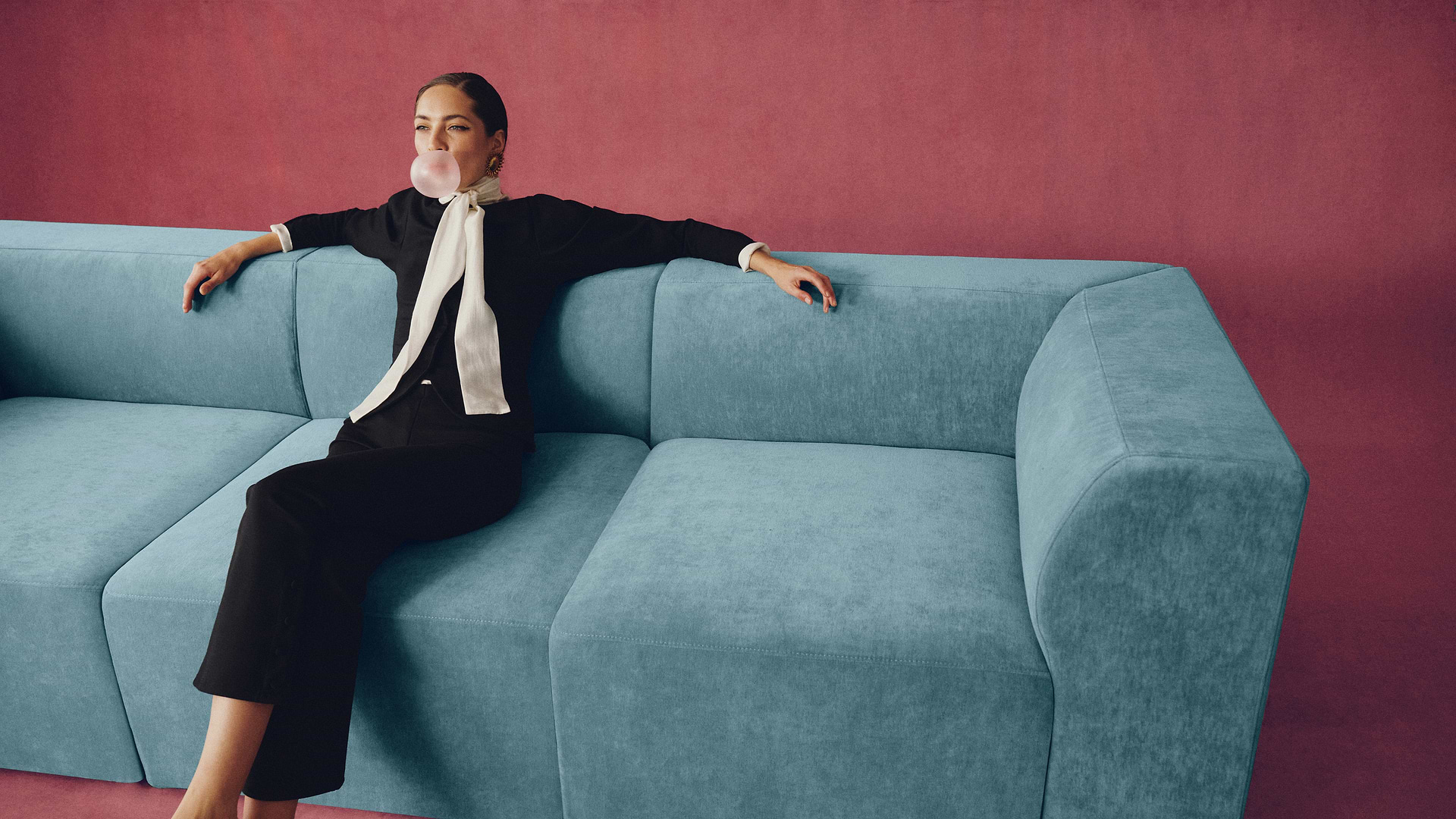 Woman on blue sofa