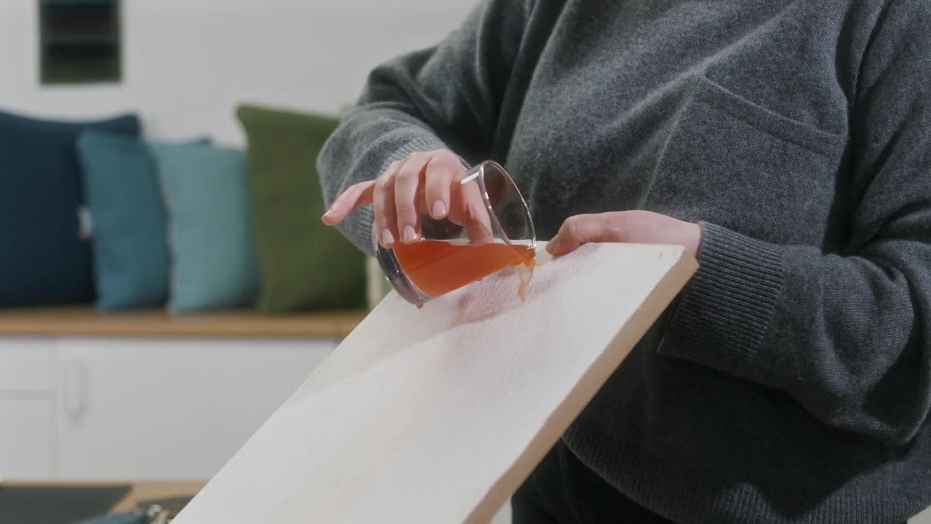Video showcasing the Aquaforte fabric's liquid-resistant properties as various liquids are poured over the fabric.